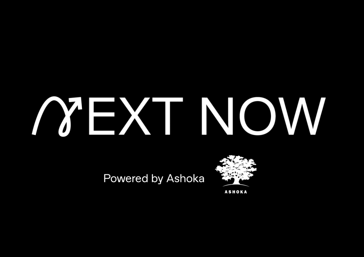 next now Logo. Black background. NEXT NOW in white letters in the middle of the photo, where the N is written in cursive with an arrow at the end of the n. Underneath is a line that says "Powered by Ashoka" in smaller lettering with the Ashoka tree logo, all in white.