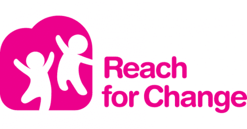 Picture of two cartoon children outlines (in white) with arms up jumping in a pink background; letters in Pink to the right of the picture saying "Reach for Change" in the same color Pink as the background