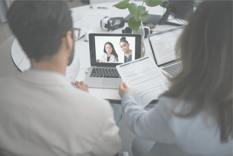 two persons with computer