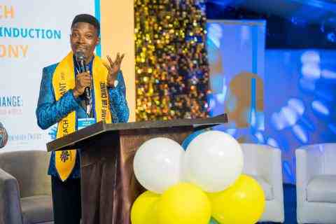 An educator addressing his colleagues during the CTEACH Graduation Ceremony