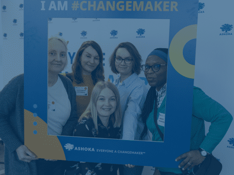 5 women posing inside a photo frame with caption "I AM #CHANGEMAKER"