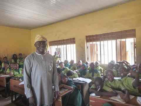 Mr Dauda and a class of JSS1 students in Lagos, Nigeria