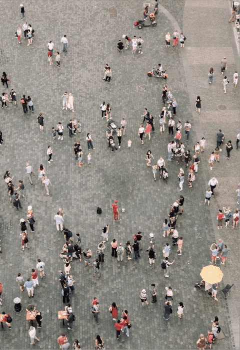 Groups of people in a plaza, shot from above.