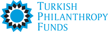 Light blue, black, and white mandala star off to the left side; to the right, the words TURKISH PHILANTHROPY FUNDS in capitalized light blue lettering; each word on top of the other.