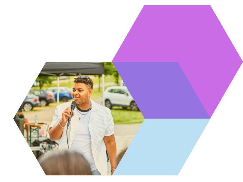 Young person speaking into a microphone