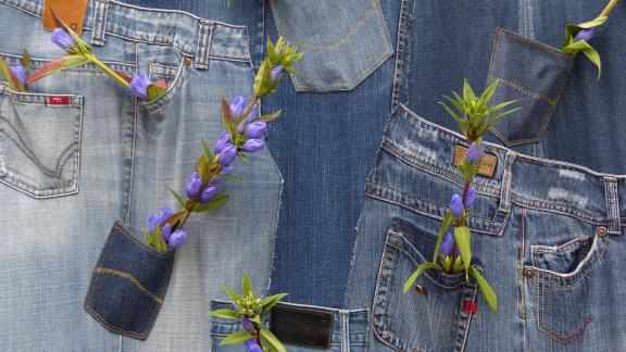 Blue jeans with flowers in the pocets