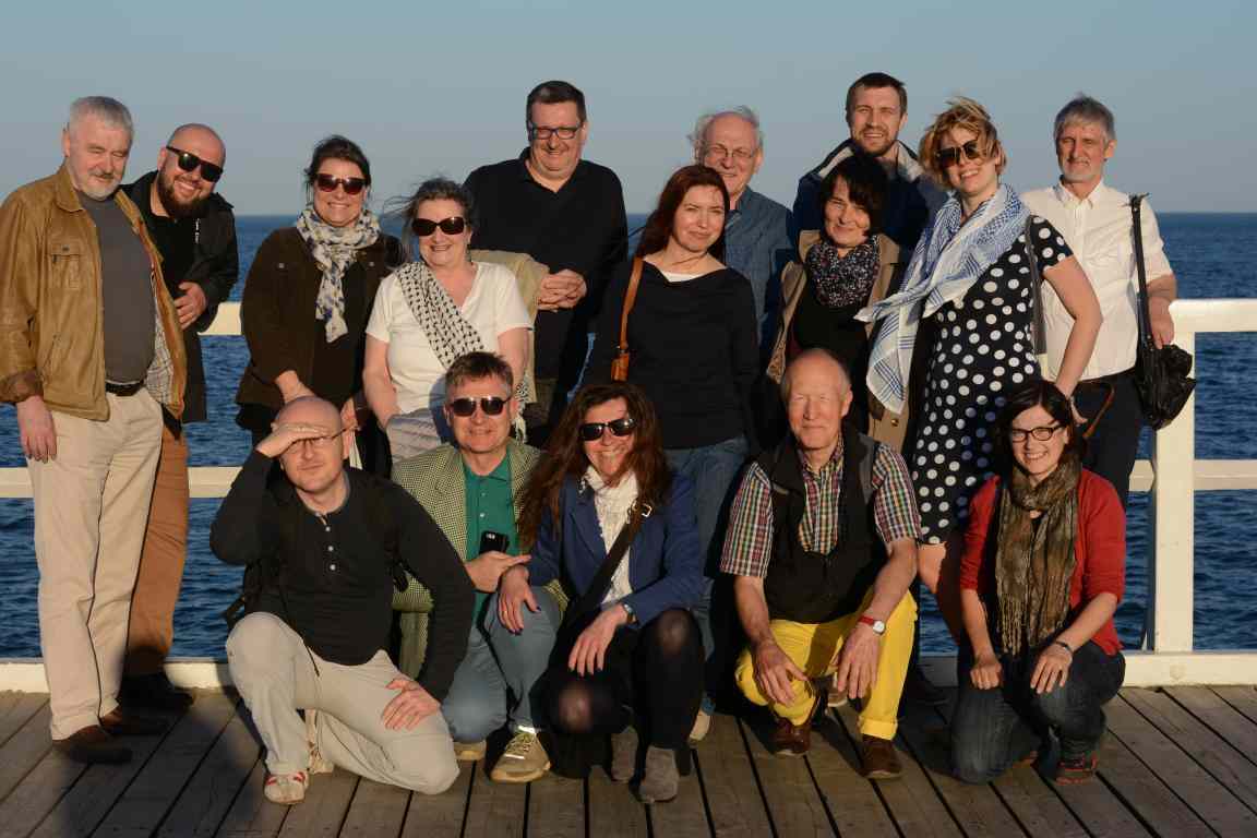 Group of people in diffrent age at pier