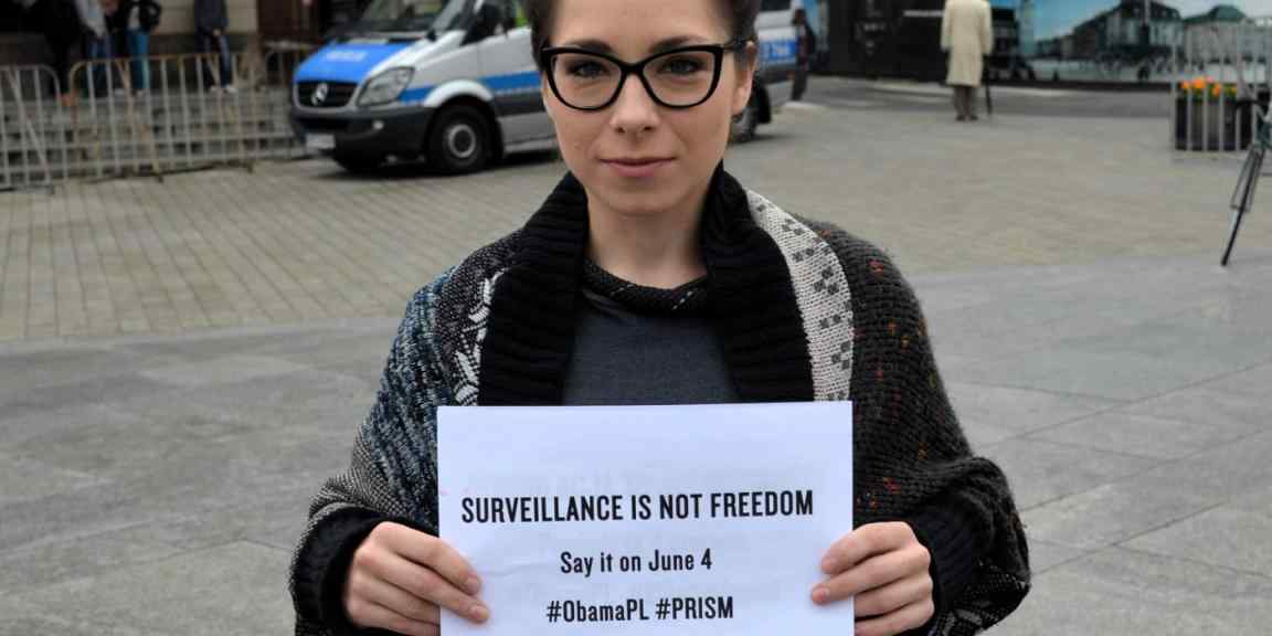 Women with banner: survillance is not freedom