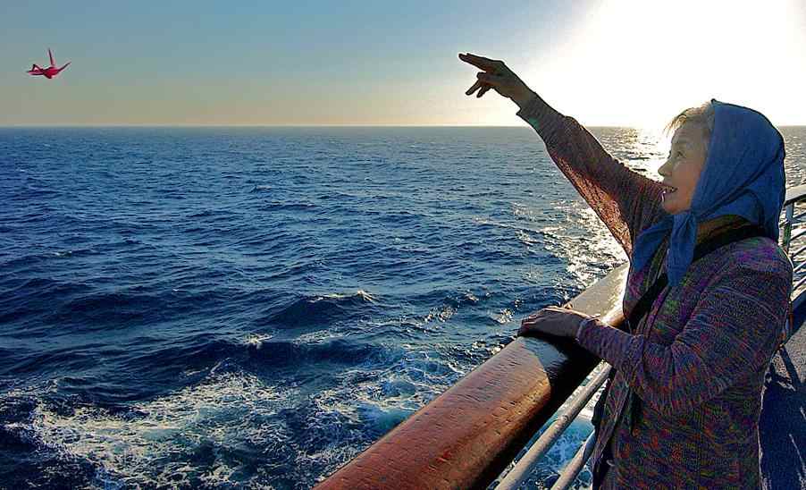 Woman pointing after releasing crane