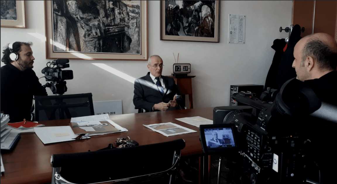 People interviewing the school master