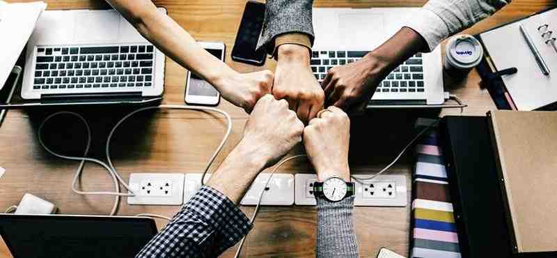 hands group together work