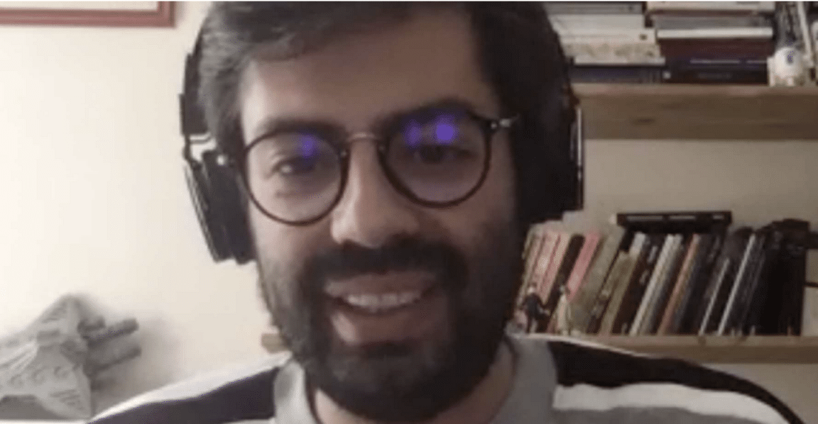 a man with glasses on webcam