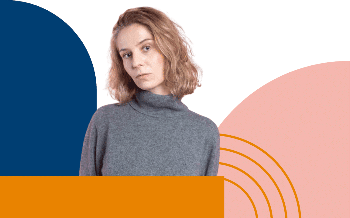 A woman in gray jumper and colorful geometrical shapes