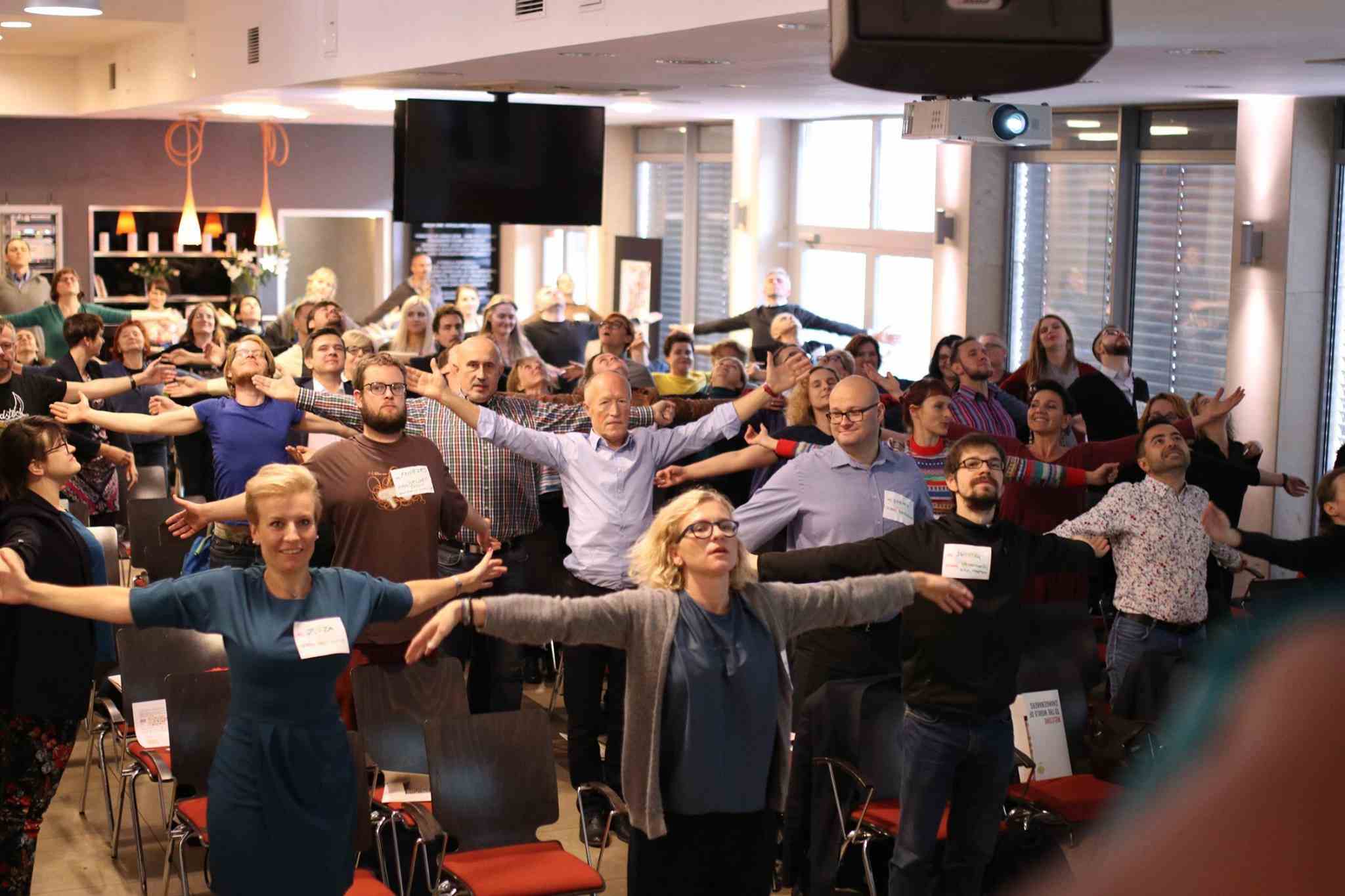 persons with arms wide open 