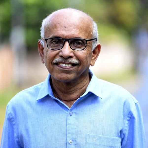 Senior Fellow MR Rajagopal. He is an Indian man with short white hair wearing glasses.