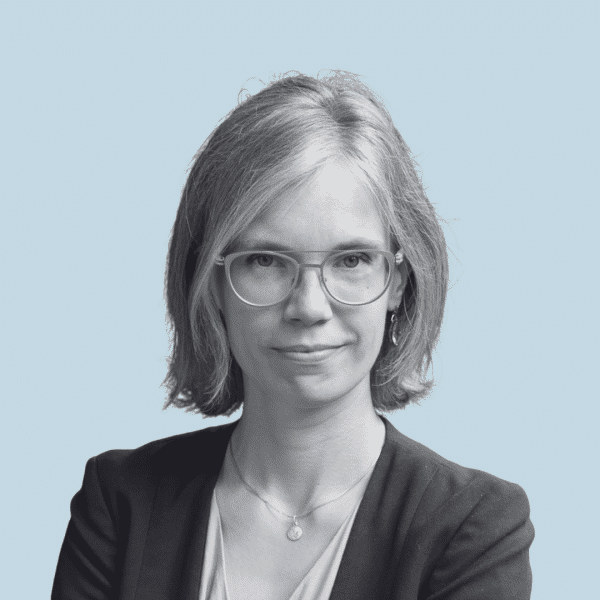 Woman in glasses looking at the camera