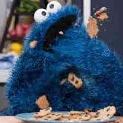 Cookie Monster eating many cookies