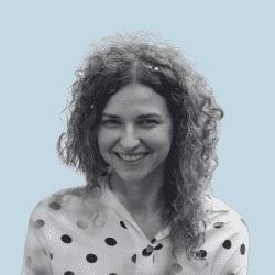 Young woman with curly hair, smiling