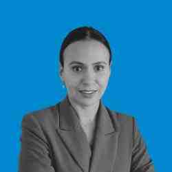 Woman in suit looking at the camera