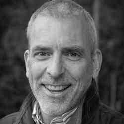 Black and white headshot of Peter Mortifee, ASN member in Canada. Person with short grey hair and goatee smiling at the camera. Background is outside