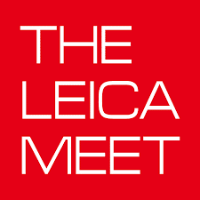 Red square. "The Leica Meet" in white text all capital letters, within the red square