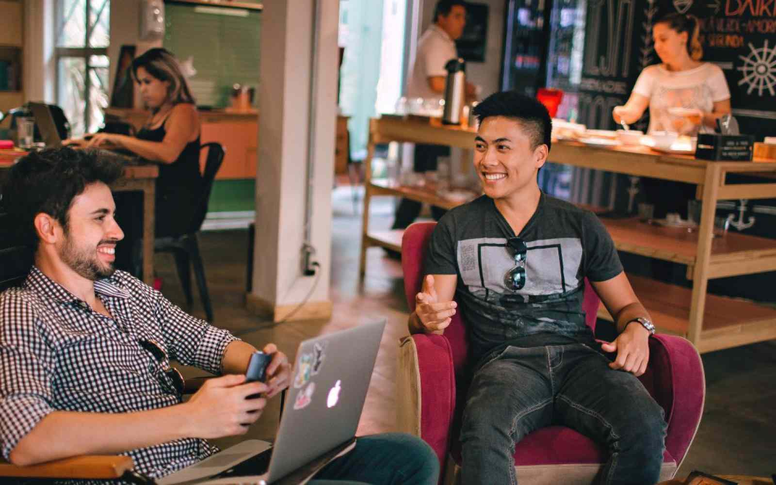 young people smiling at their computer