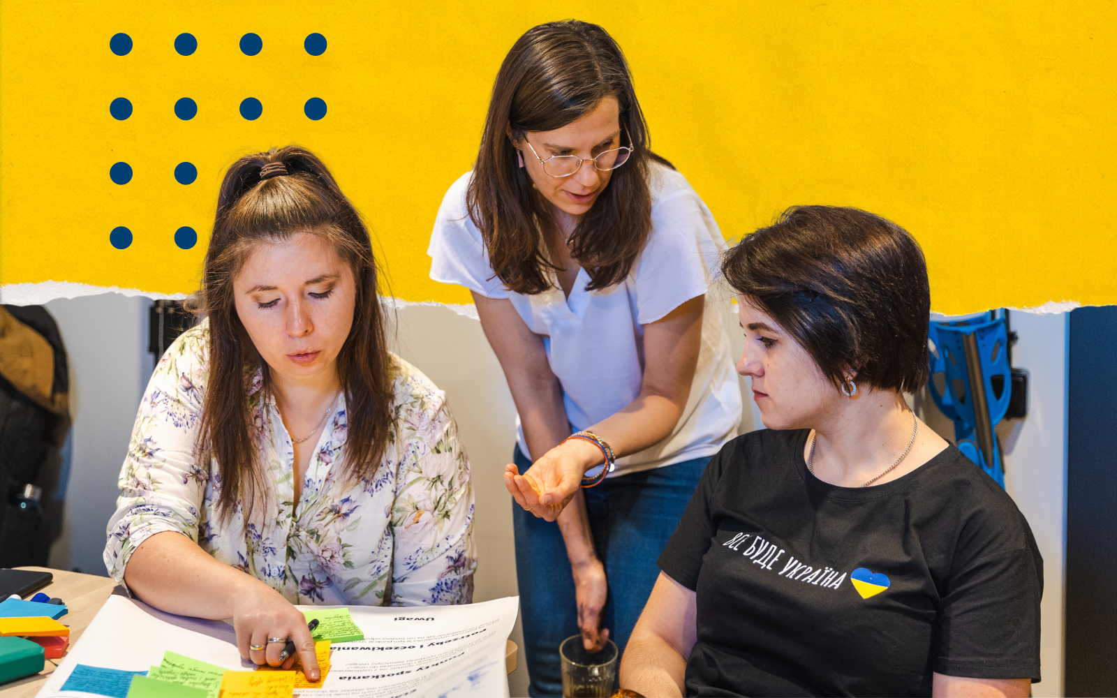 Three women working on buisness canva
