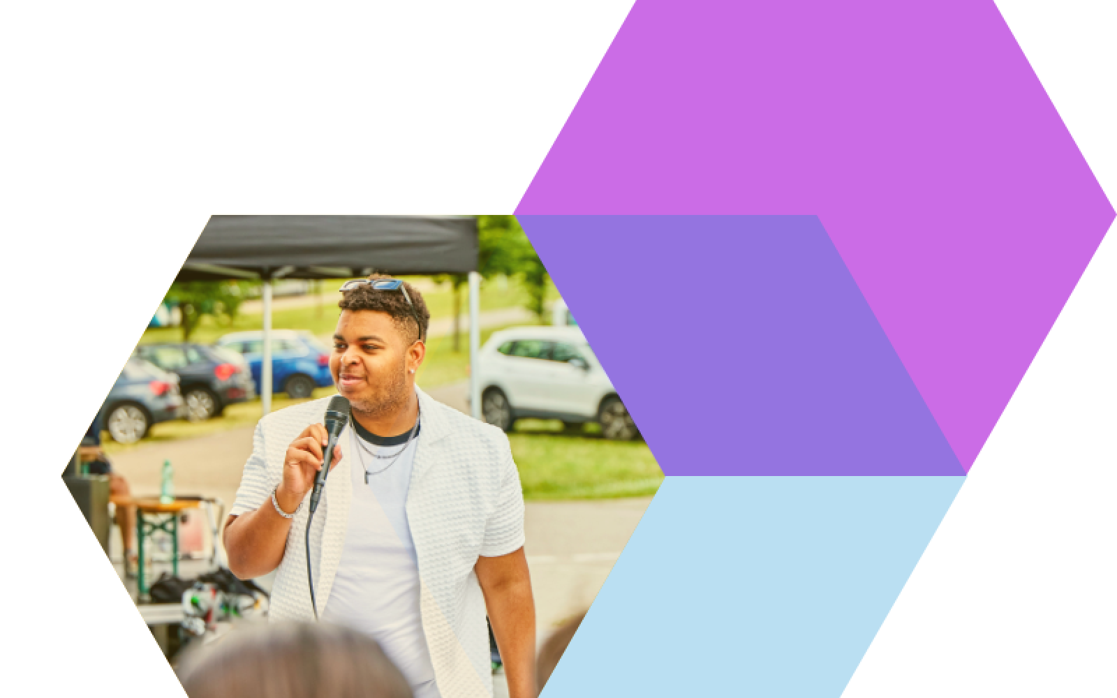 Young person speaking into a microphone