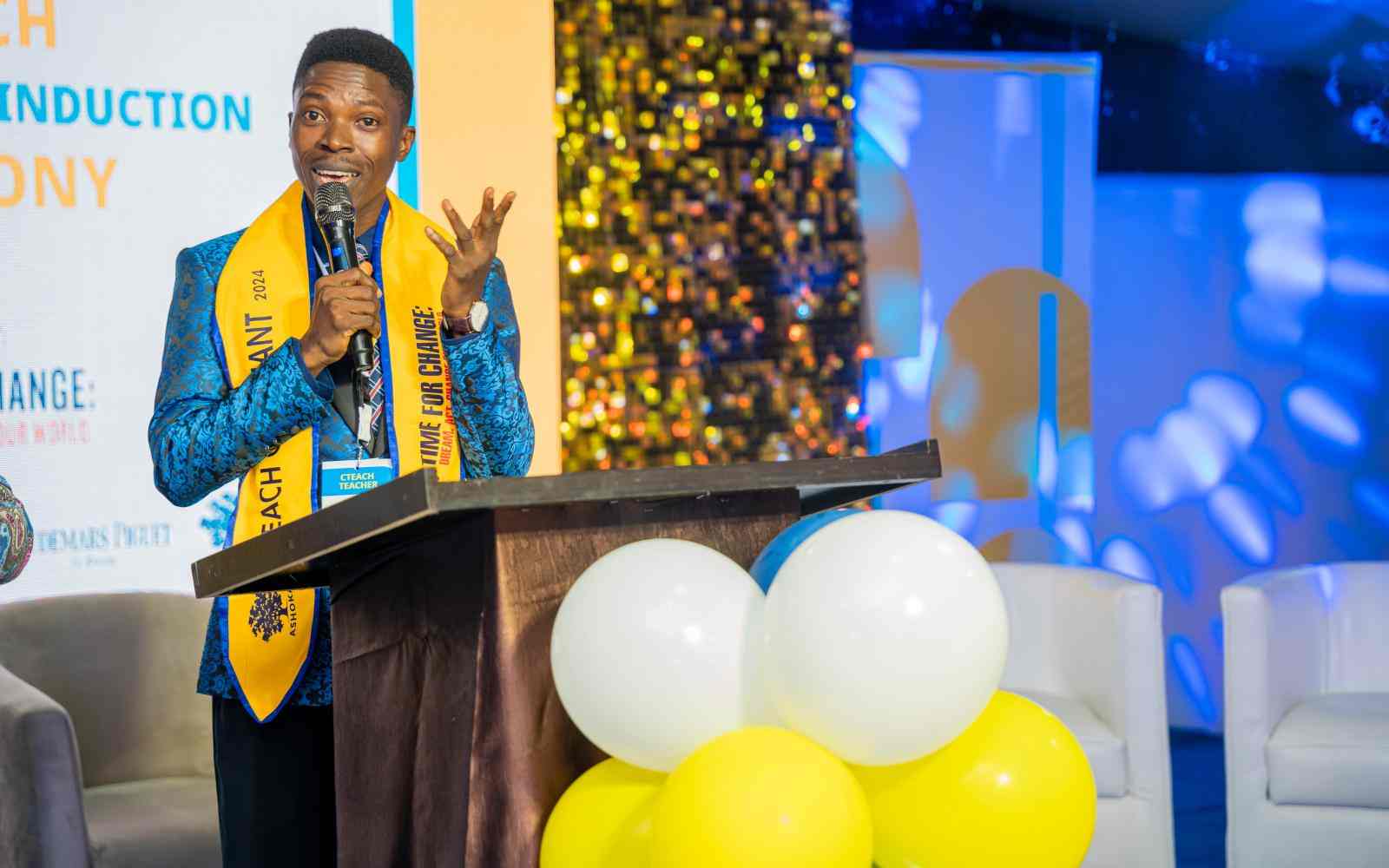 An educator addressing his colleagues during the CTEACH Graduation Ceremony