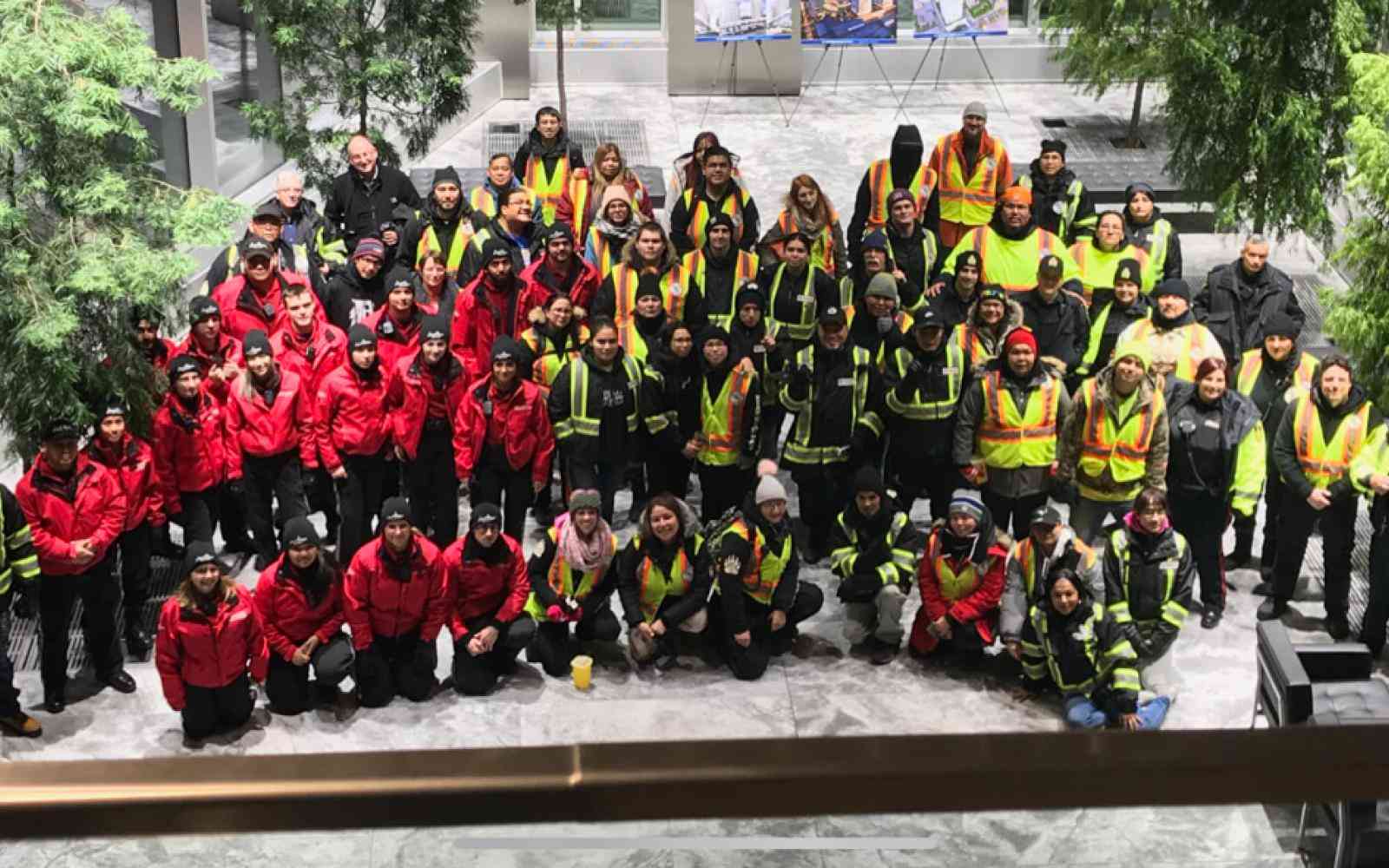 Large group photo of the people involved with the Bear Clan Patrol – from firefighters to neighborhood patrol etc.
