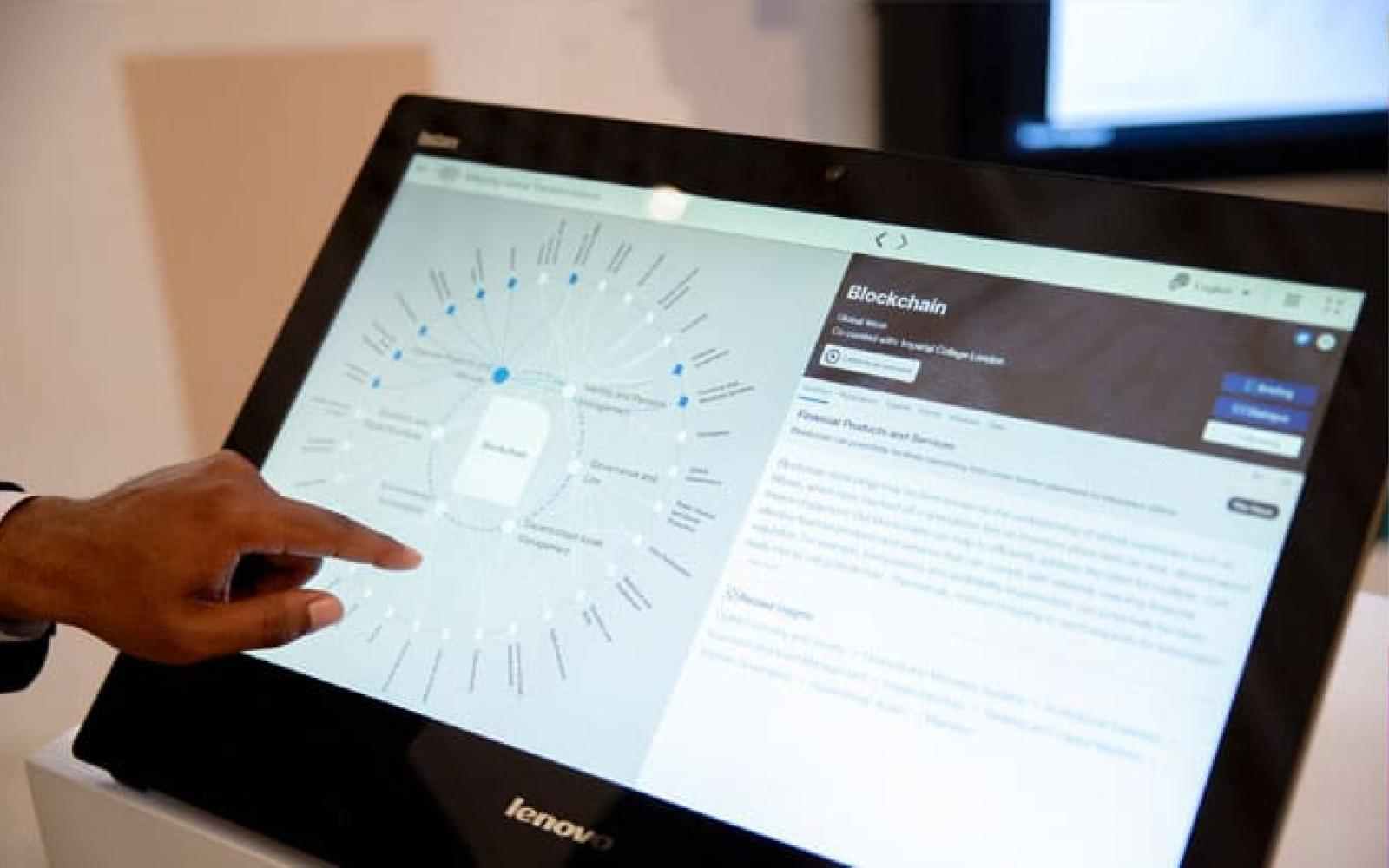 Photo of someone using a touchscreen computer
