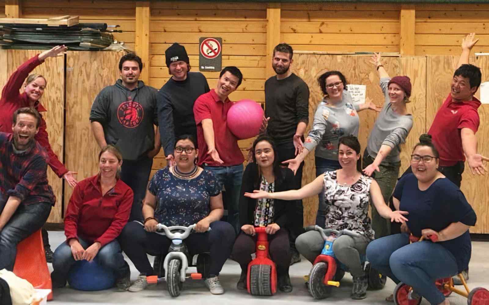 Photo of a group of people at Ikaarvik, 2019; backdrop of a warehouse