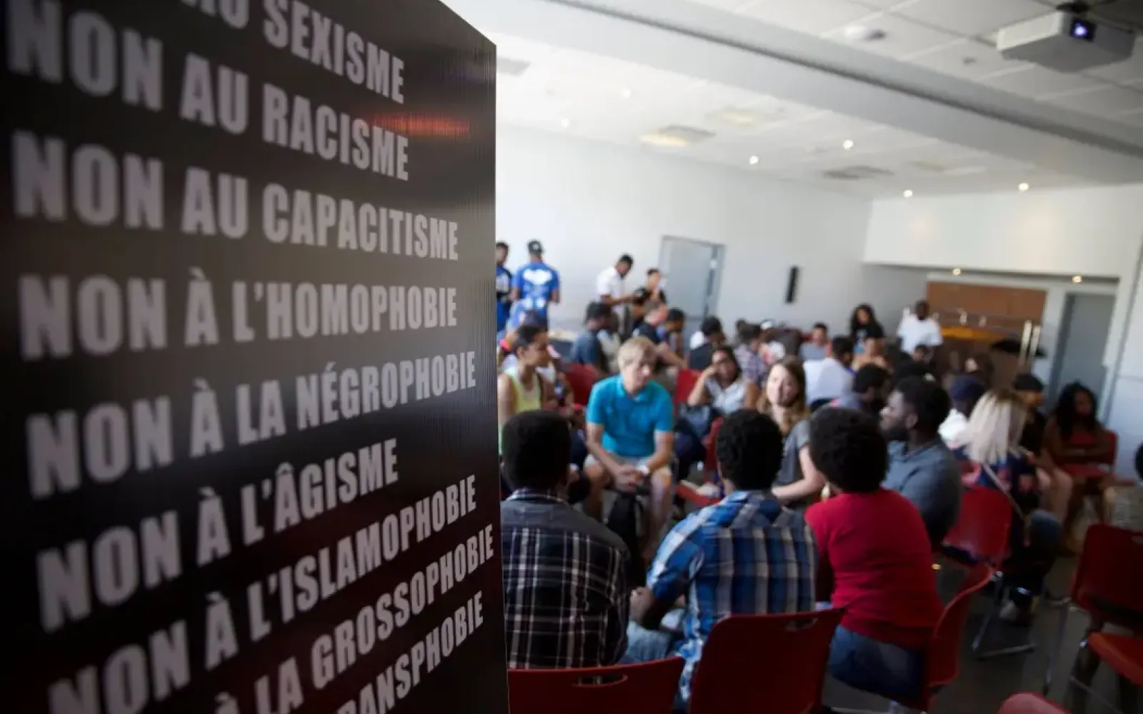 Photo of youth participating in a Hoodstock workshop indoors