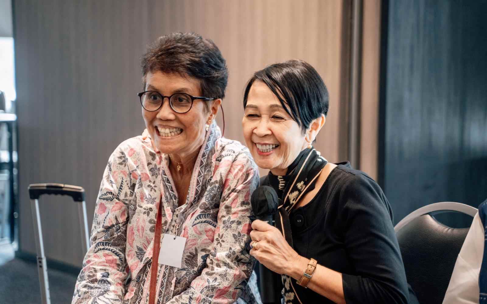 Headshot of a two women smiling.
