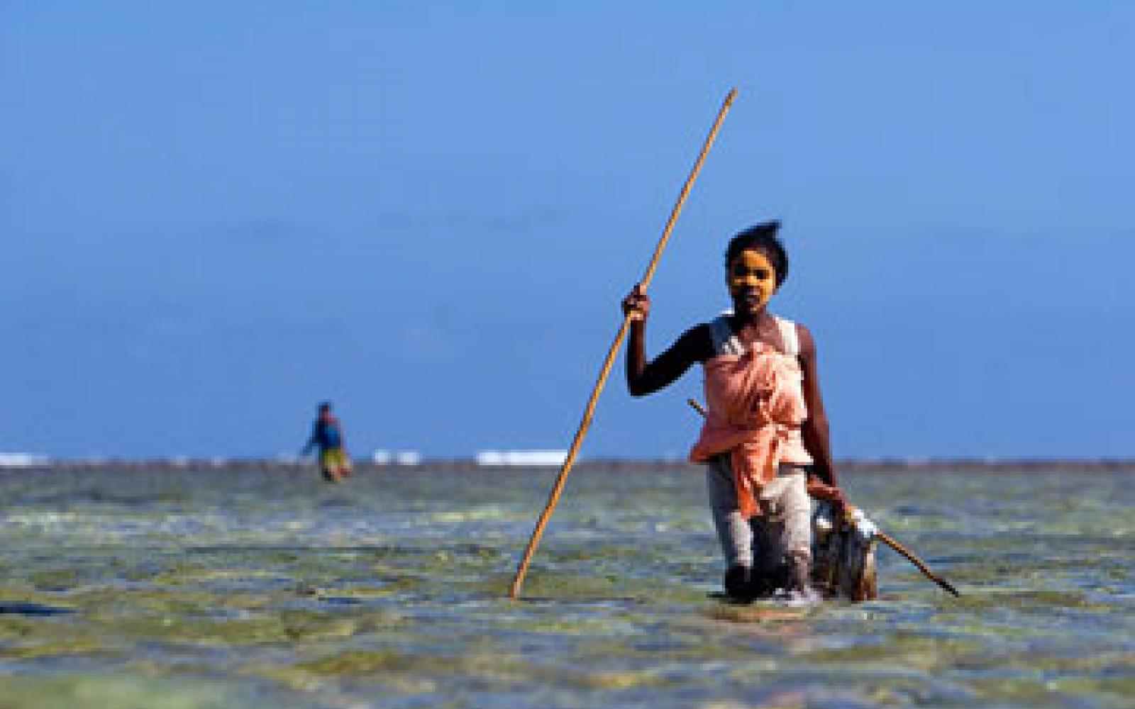 Woman spear fishing