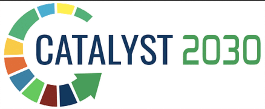 Catalyst 2030 logo. Words: Catalyst in blue. 2030 in Green. Arrow filled with many different colors starting in a circle above the second a in Catalyst, continuing around the C in Catalyst, and ending again below the second A in catalyst. Colors in arrow: green, yellow, blue, green, yellow, orange, blue, green, brown, blue, and green.