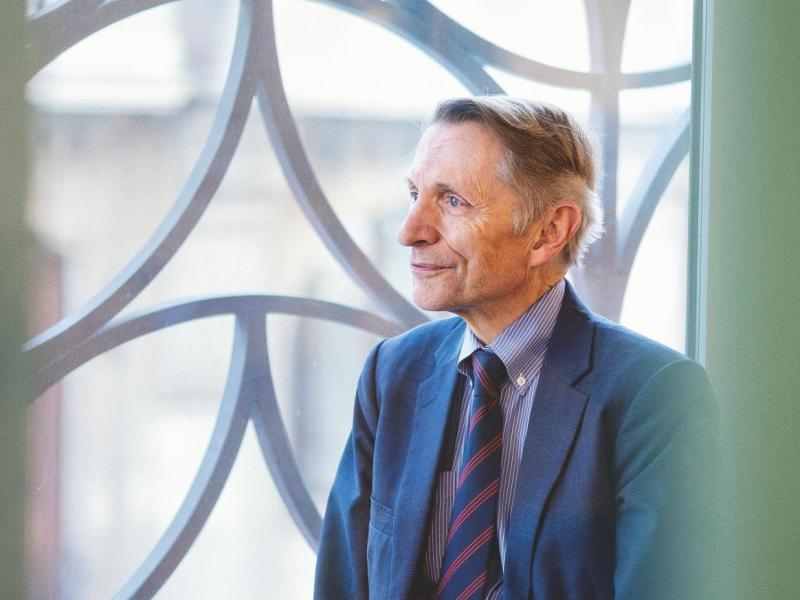 Bill Drayton by window facing left
