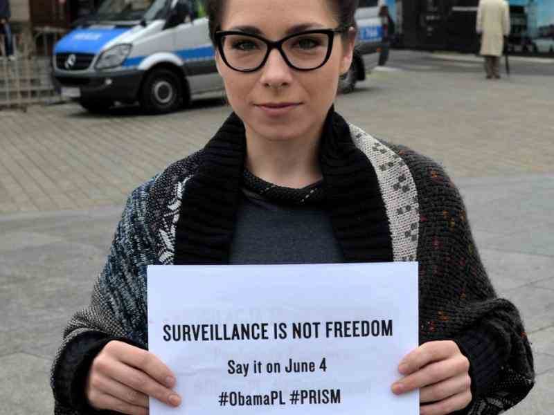 Women with banner: survillance is not freedom