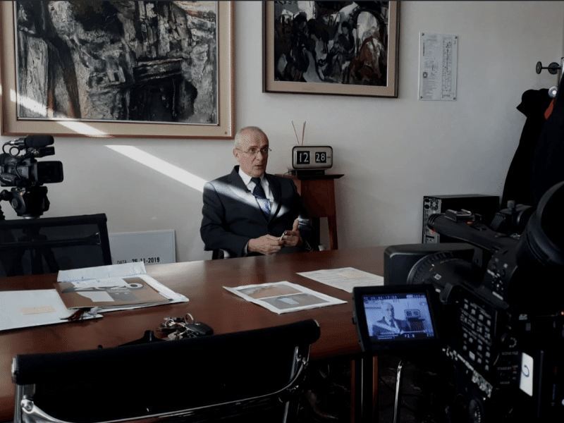 People interviewing the school master