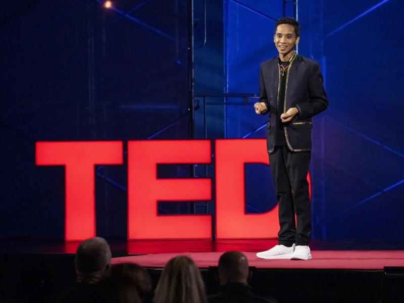 Ashoka Fellow Ryan Gersava speaking before the TED logo 
