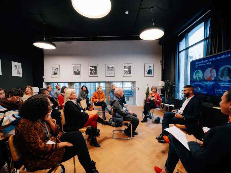 Photo of workshop with speakers and participants seated in rows