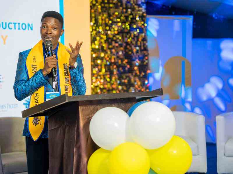 An educator addressing his colleagues during the CTEACH Graduation Ceremony