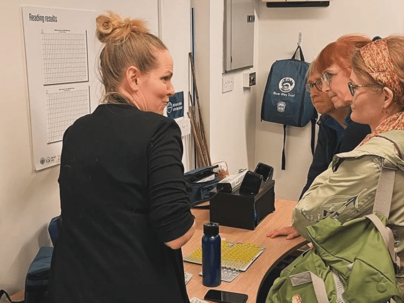 Ashoka Canada Fellow Kat Kavanagh discussing with three others in a lab