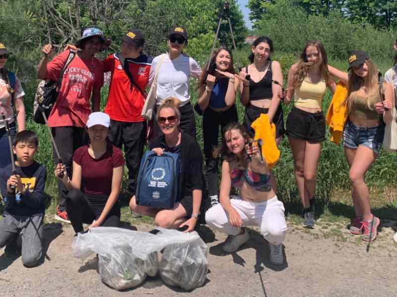 Group of youth smiling at the camera as part of Ashoka Canada Fellow Kat Kavanagh's project Water Rangers