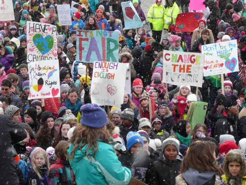 Group of young and old people at a protest for Children's rights in Canada